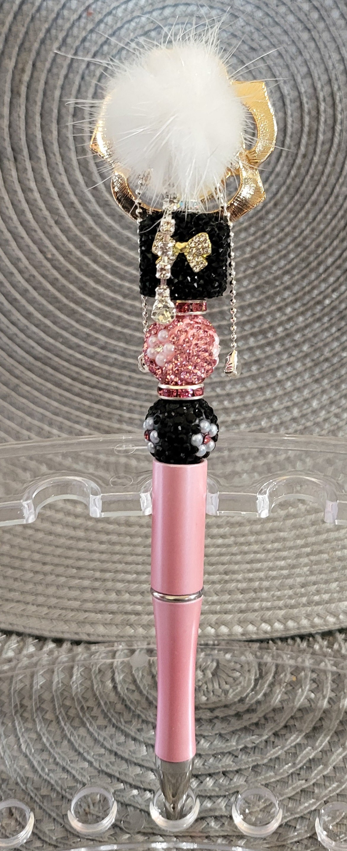 Pluma de flor giratoria