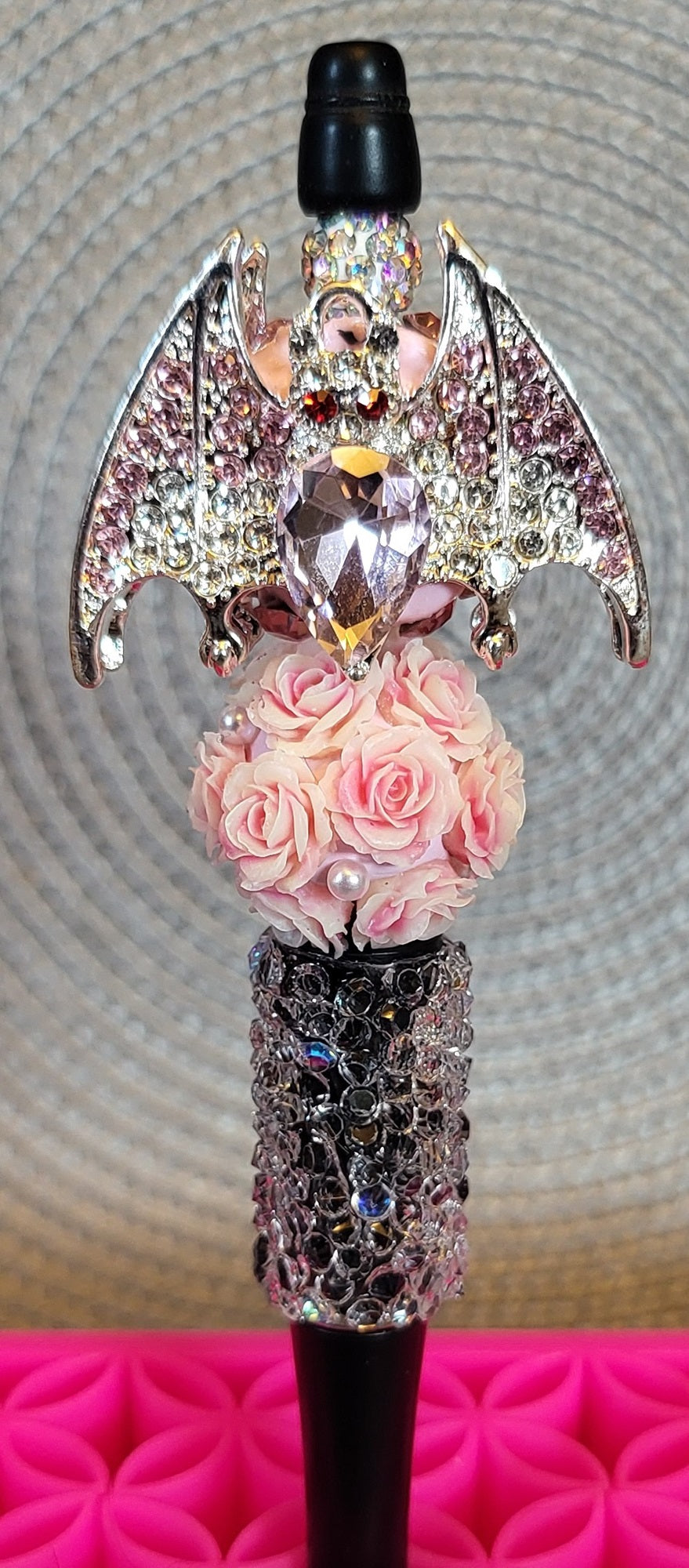 Rhinestone Bat Sitting on Flowers